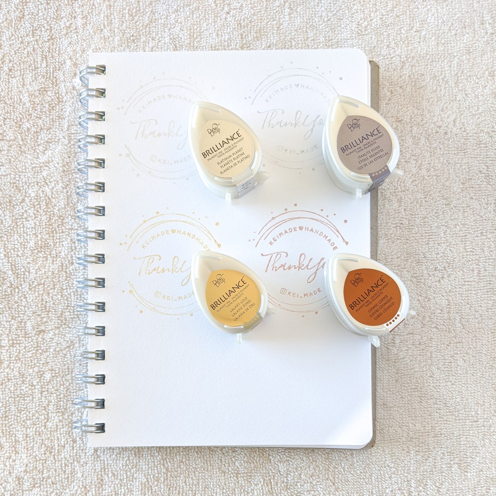 Here's what Tsukineko Brilliance metallic ink pads look like when stamped on white paper | ツキネコのブリリアンスメタリックスタンプを白い紙に押してみた