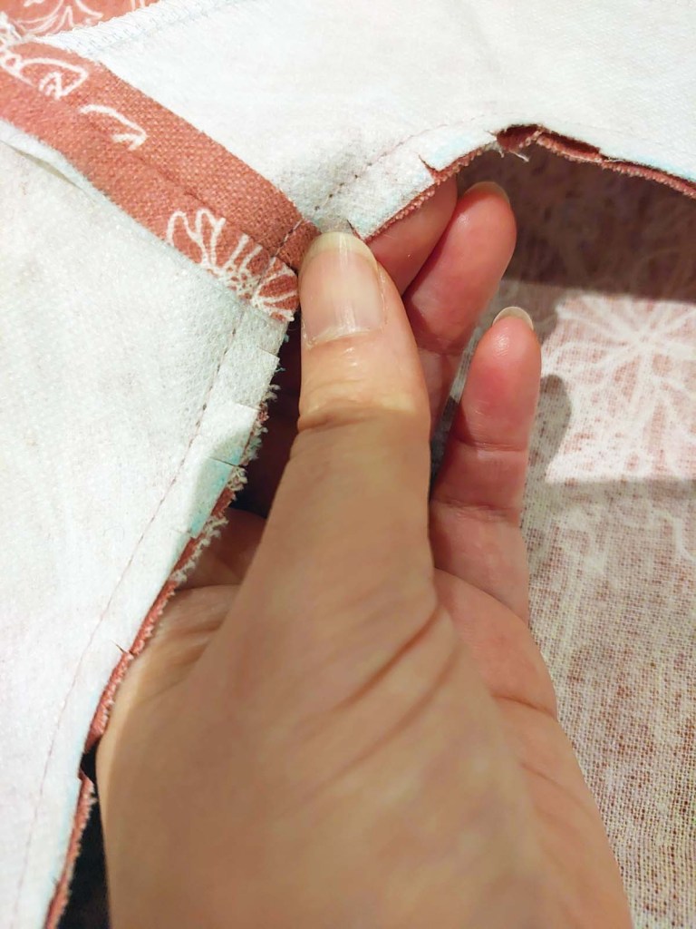 How to cut slits into a collar facing for dress making