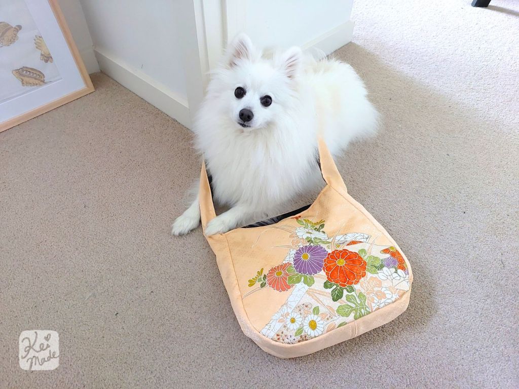 Japanese Spitz dog Shinji helping to sew a shoulder bag upcycled from a kimono